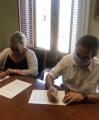 Signatura addenda Federació de VeÏns